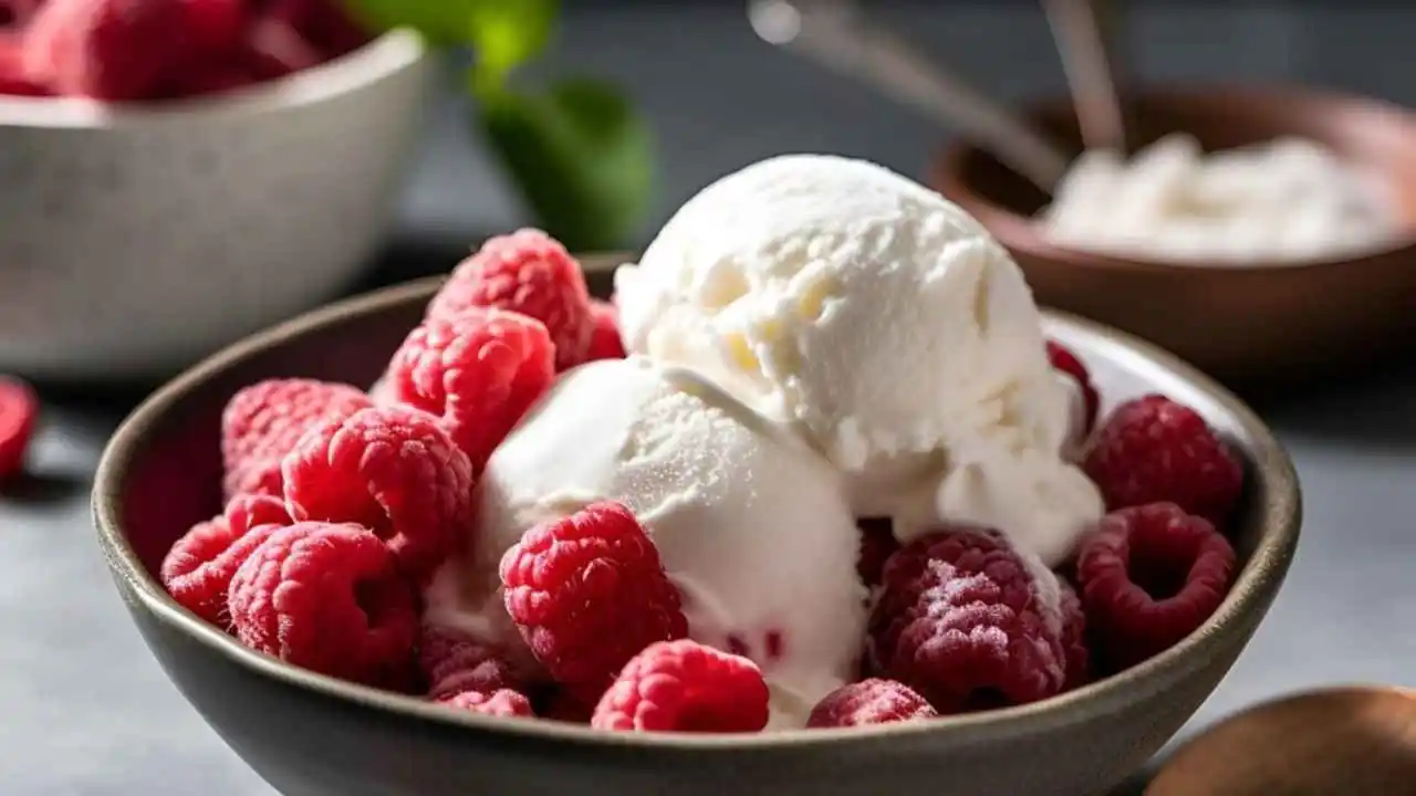 raspberry ice cream bowl with fresh raspberries